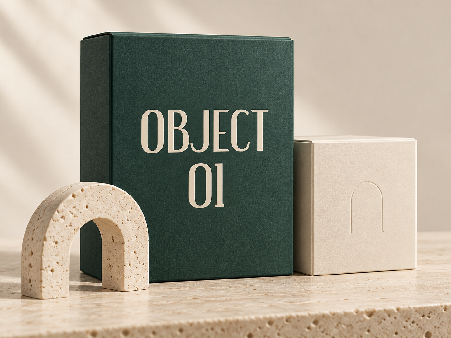 Generated concept of forest-green Object 01 packaging beside a cream box with an embossed arch and a stone display prop.